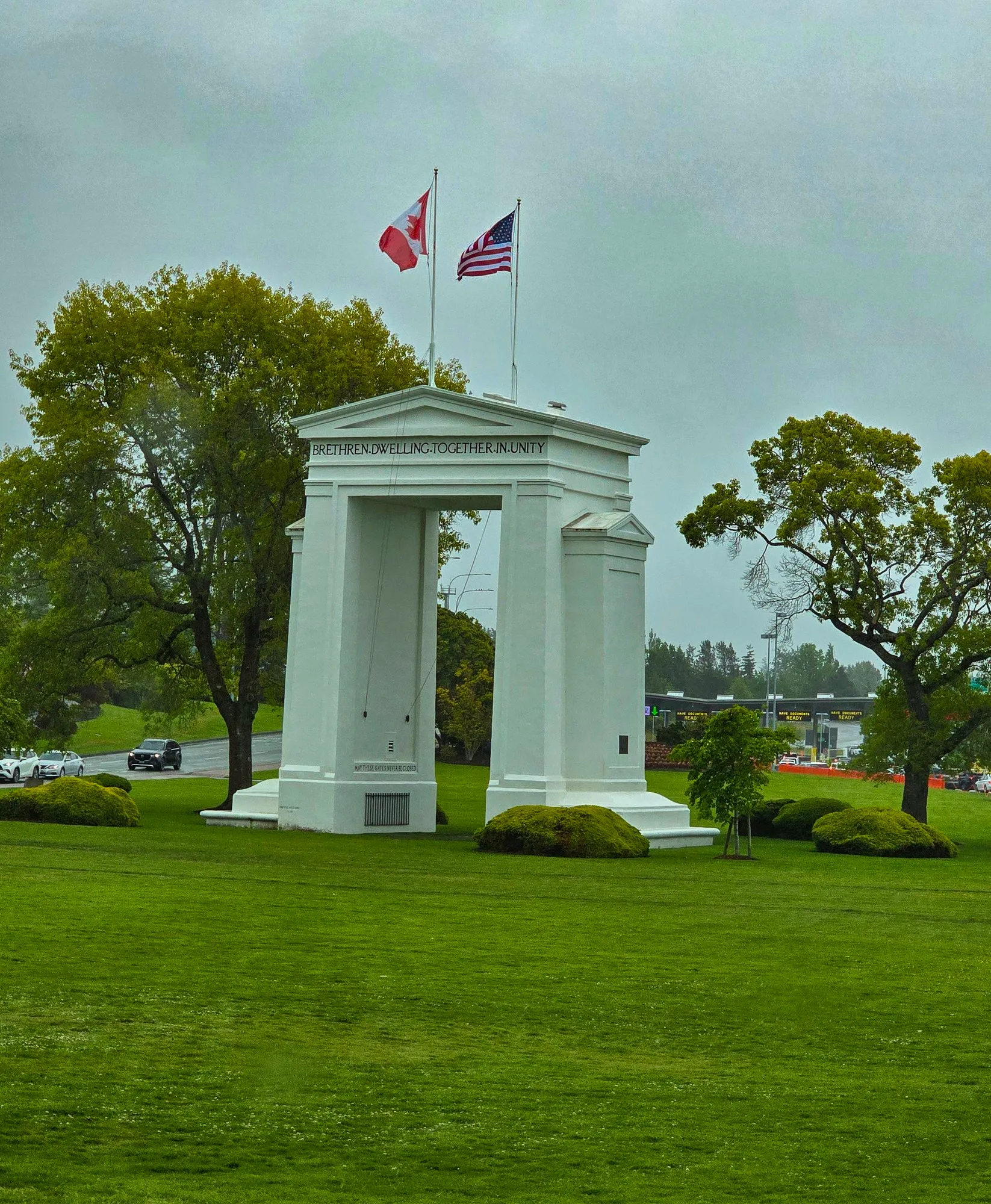 The Peace Arch at the border crossing, the Canadian and American flags on top