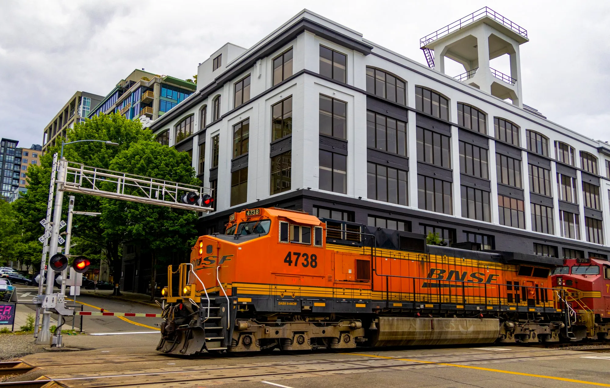 A BNSF freight train at the crossing beside the Olympic Sculpture Park