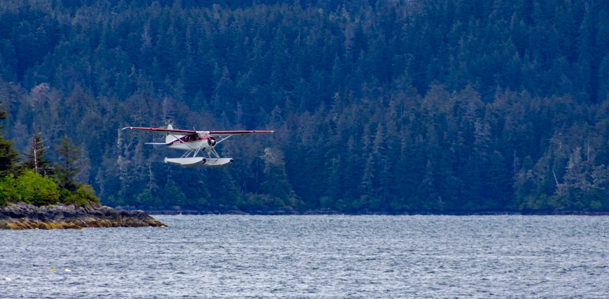 A floatplane low over the water off Sitka, with the lens at 400 mm