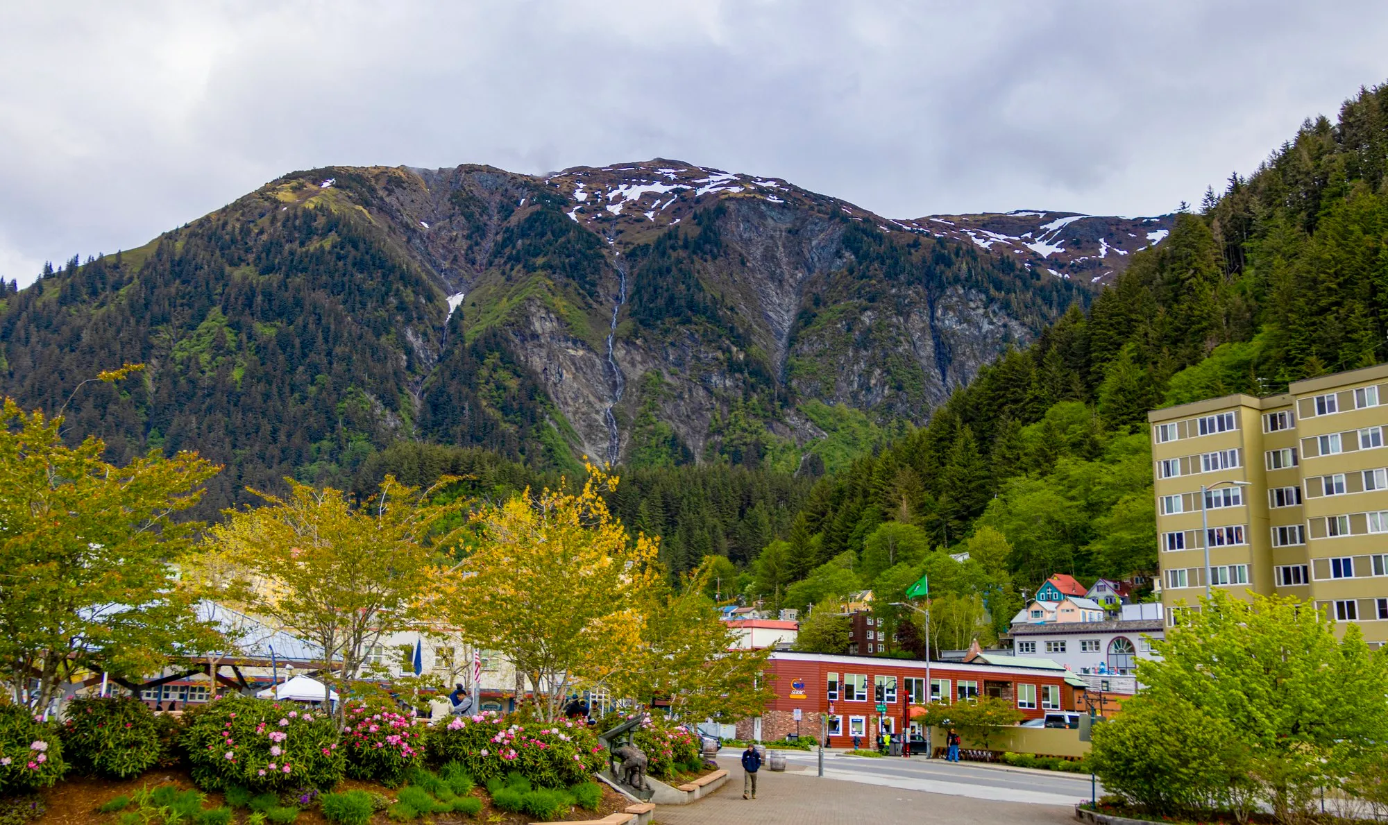 Downtown Juneau in the morning with the mountainside straight behind the buildings