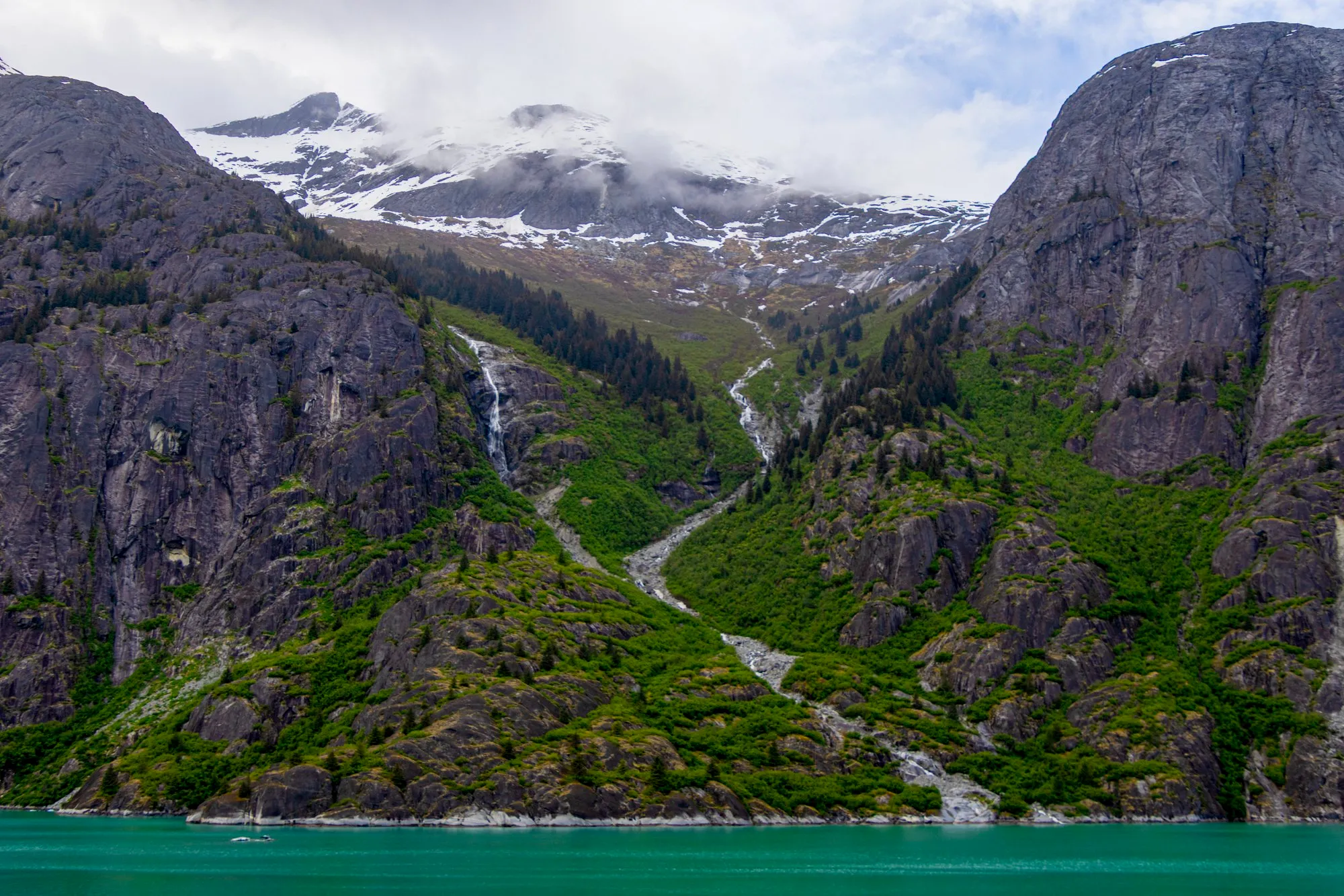 Waterfalls down the granite wall of Endicott Arm