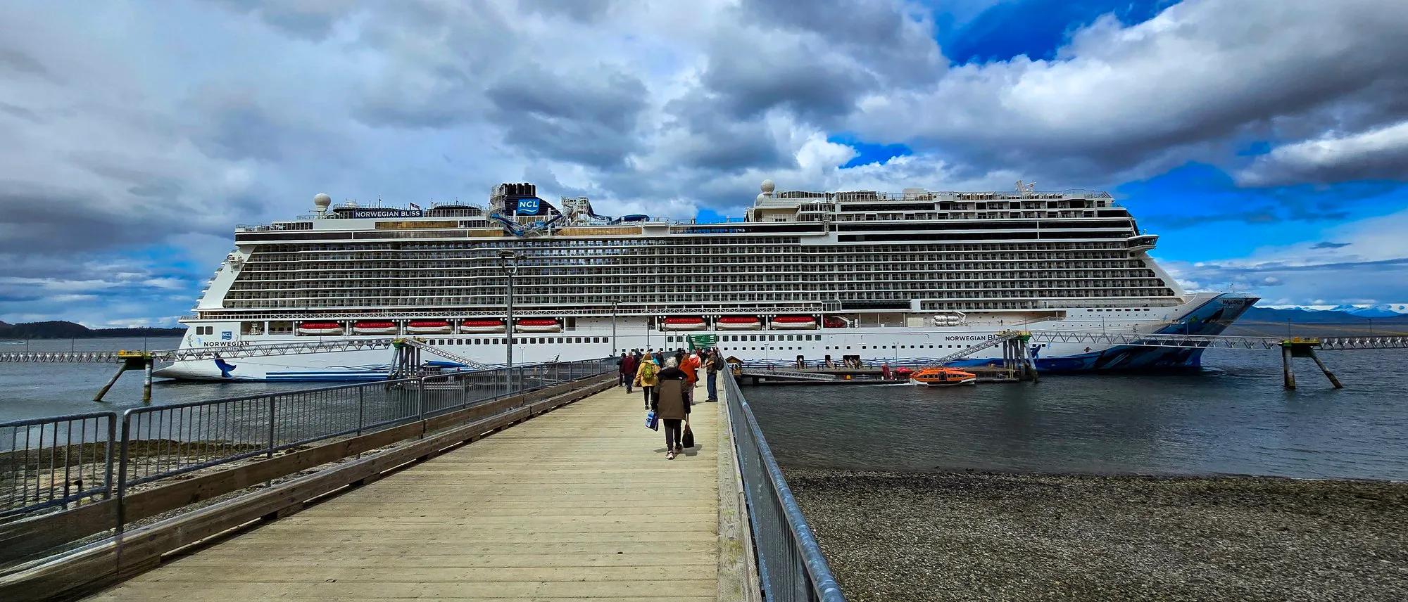 Norwegian Bliss at the Icy Strait Point pier, passengers walking back