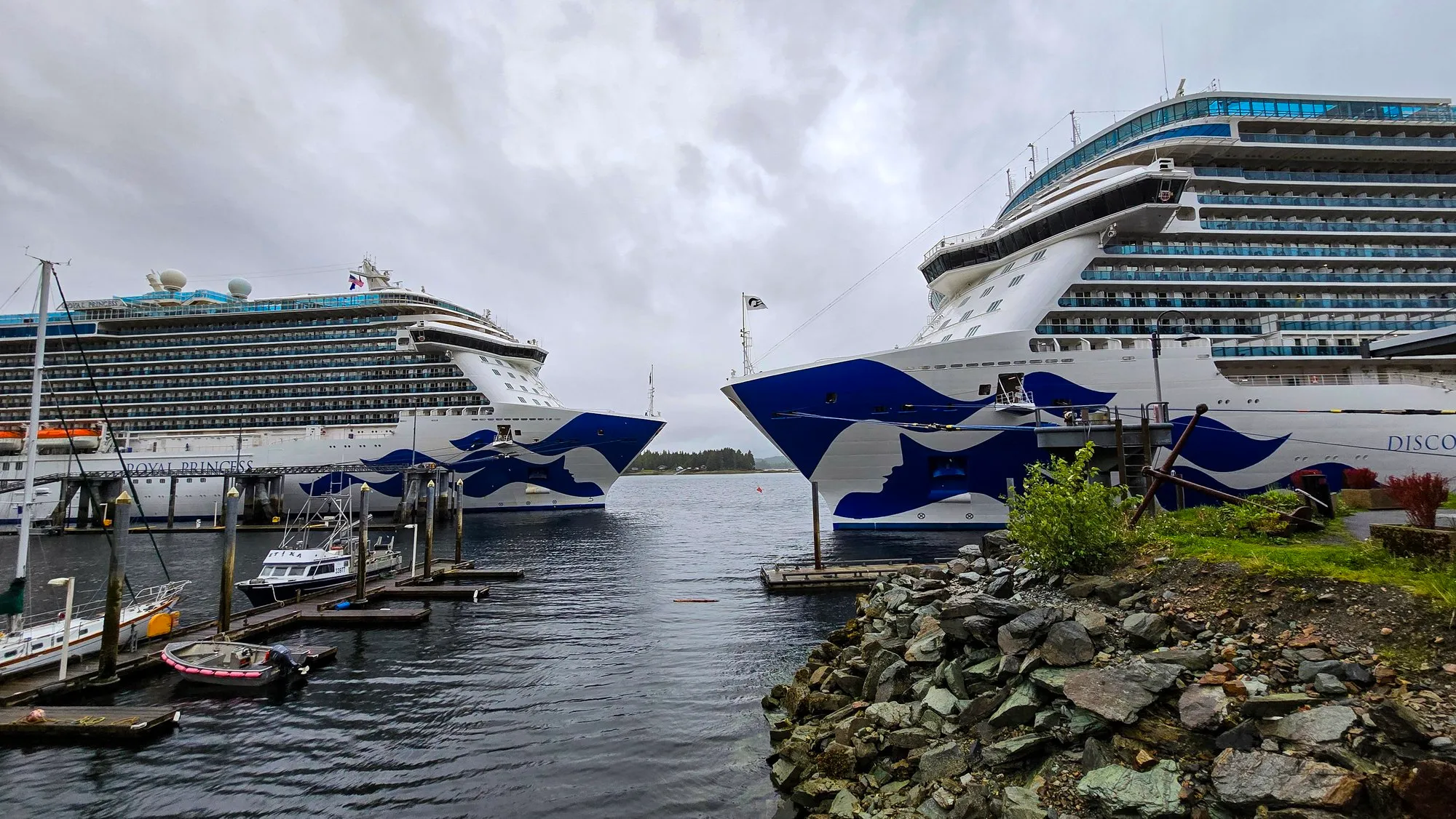 Two cruise ships at the downtown Ketchikan docks in the rain