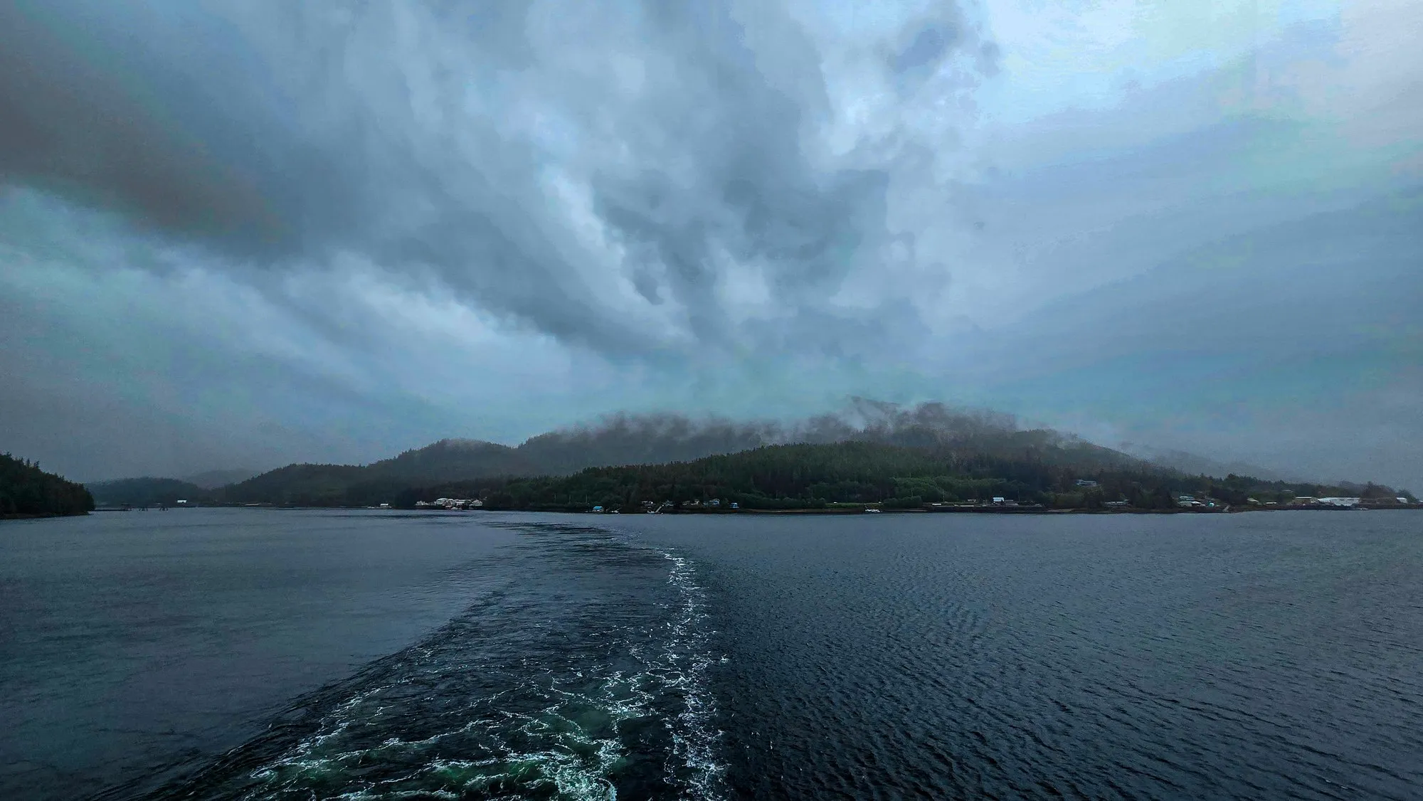 Leaving Ketchikan through Tongass Narrows, low cloud on the hills and rain on the water