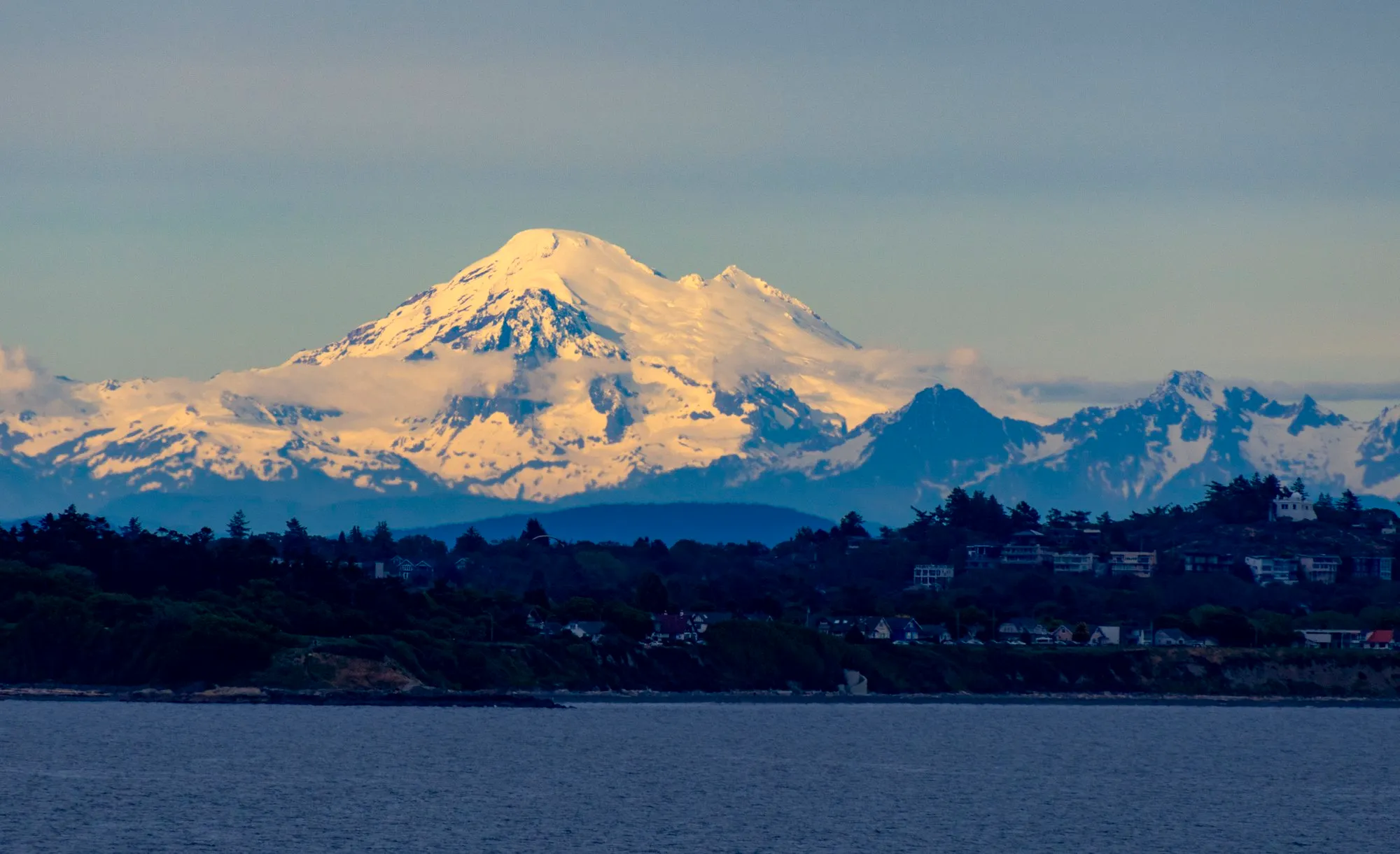 Mount Baker from the Strait of Juan de Fuca, 79 miles off, with the lens at 246 mm and evening light on the snow