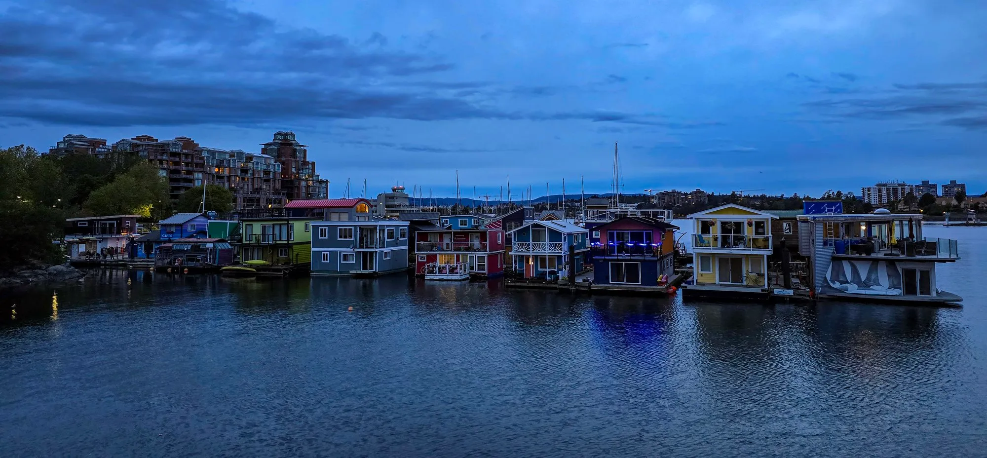 The floating homes at Fisherman's Wharf in Victoria at dusk