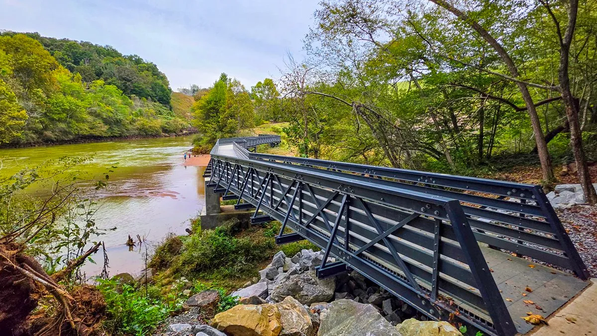 A new steel truss footbridge crossing the Chattahoochee below the dam