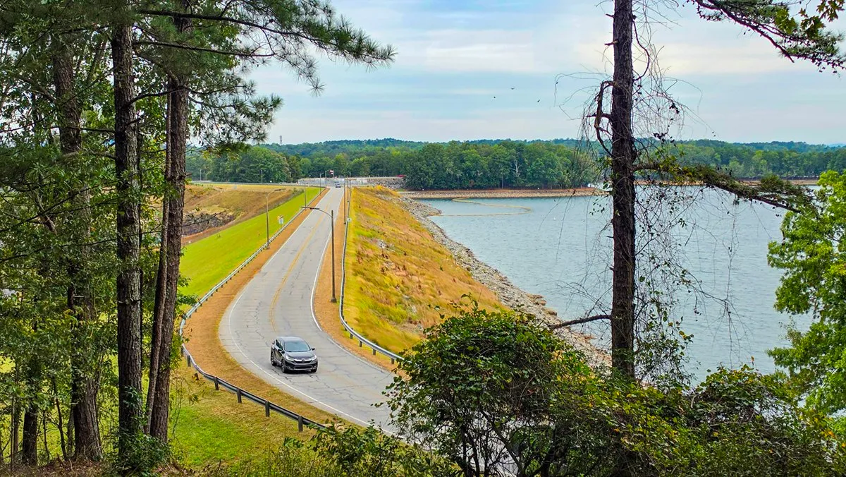 Buford Dam Road running along the top of the dam, Lake Lanier on the right