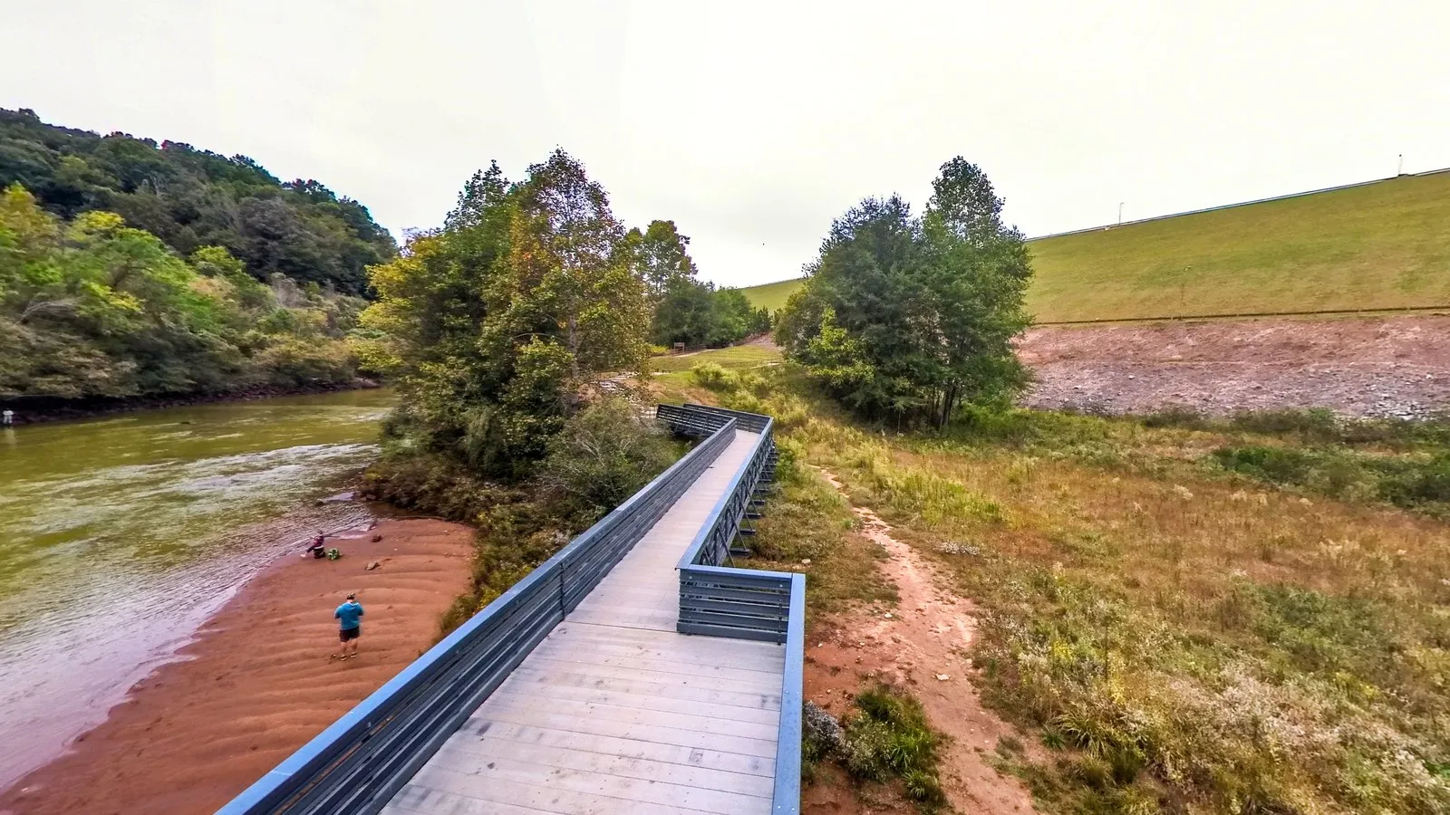 A 360 photograph from the new bridge over the Chattahoochee below Buford Dam, the river running between wooded banks and the grassy face of the dam beside it